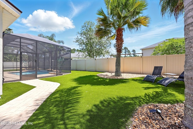 view of yard featuring glass enclosure