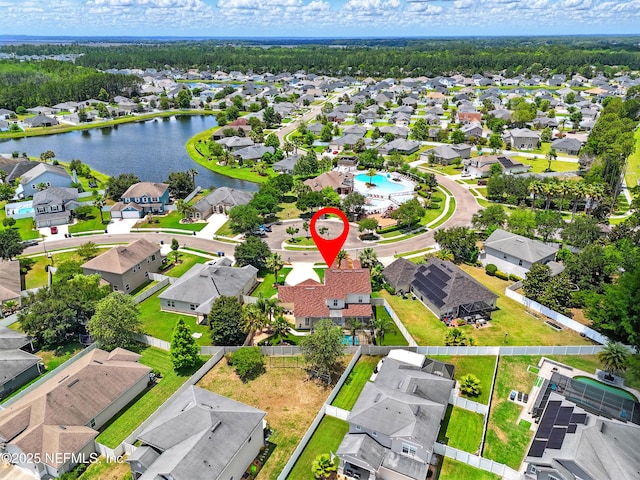 aerial perspective of suburban area featuring a nearby body of water