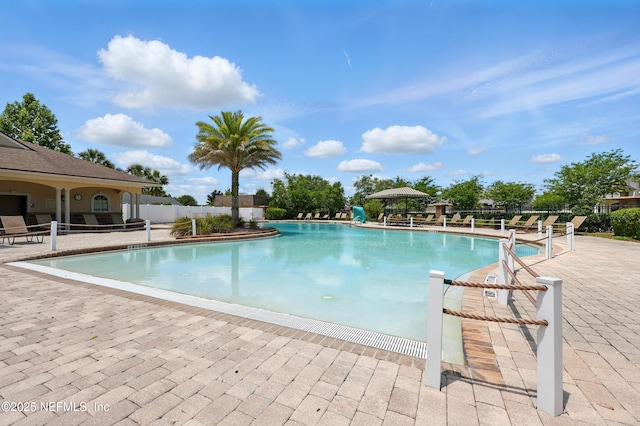 community pool featuring a patio area