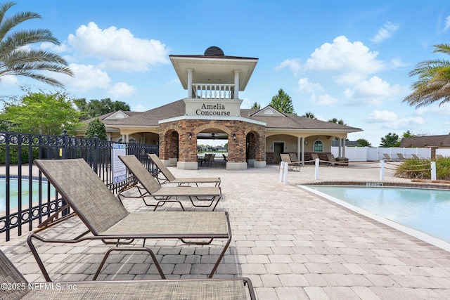 view of swimming pool with a patio