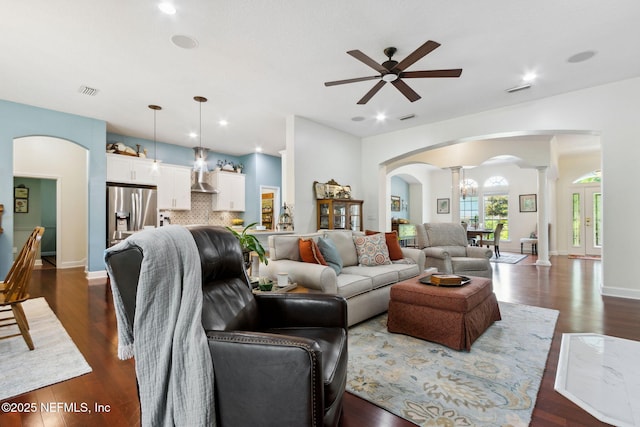 95150 Starling Ct, Fernandina Beach, FL 32034 - living area with arched walkways, ornate columns, ceiling fan, dark wood-style floors, and recessed lighting
