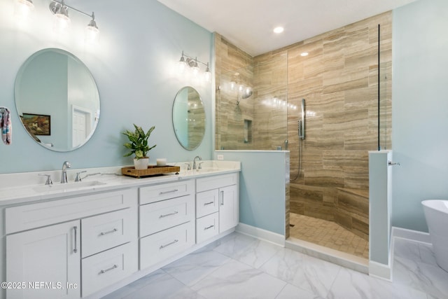 95150 Starling Ct, Fernandina Beach, FL 32034 - bathroom with double vanity, a shower stall, marble finish flooring, a freestanding tub, and recessed lighting