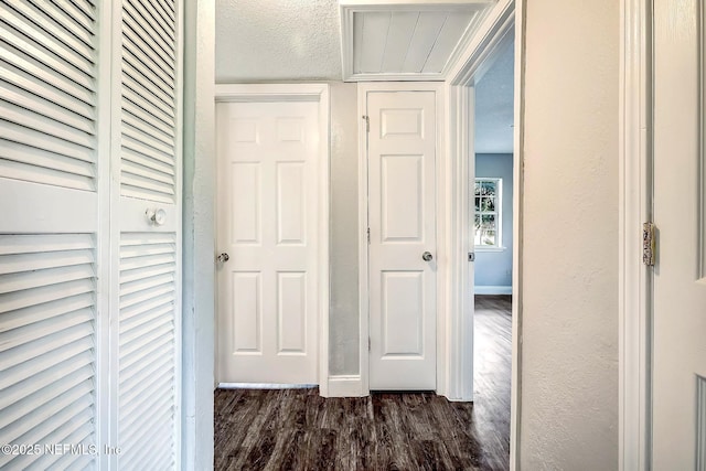 979 Mikael Ave, Jacksonville, FL 32205 - corridor with dark wood-style floors, baseboards, a textured wall, and a textured ceiling
