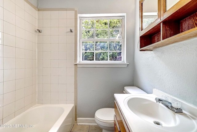 979 Mikael Ave, Jacksonville, FL 32205 - bathroom with toilet, vanity, tile patterned flooring, washtub / shower combination, and baseboards