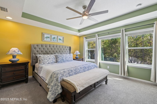 bedroom with baseboards, carpet flooring, and visible vents