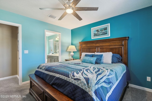 carpeted bedroom with a ceiling fan, ensuite bath, baseboards, and visible vents