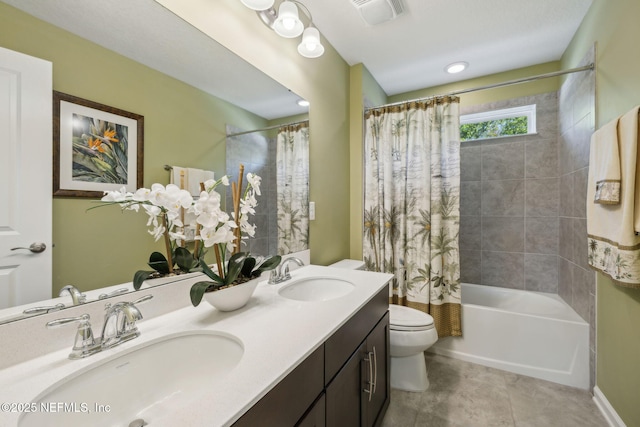 full bathroom with visible vents, toilet, a sink, and shower / bath combo