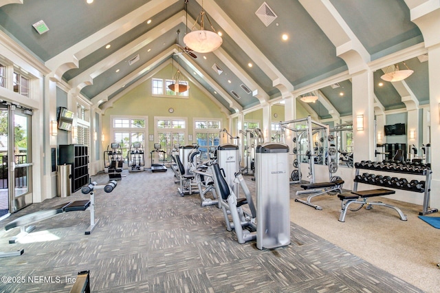 gym with carpet flooring, high vaulted ceiling, and visible vents