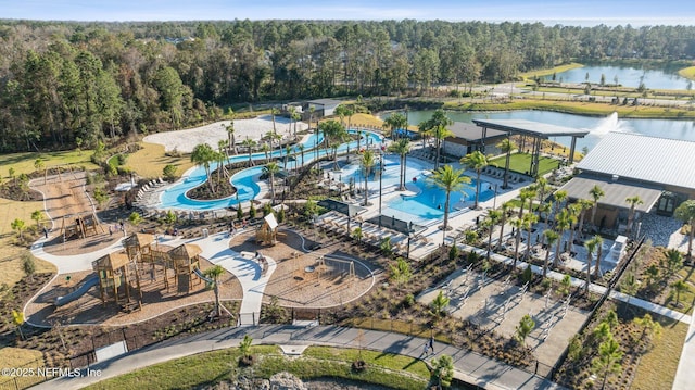aerial view featuring a water view and a view of trees