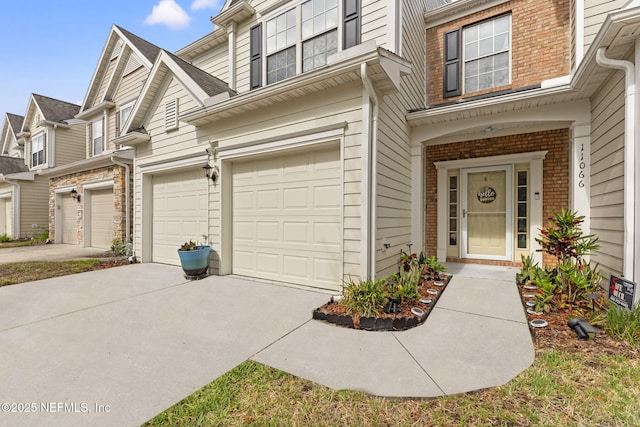 11066 Castlemain Cir, Jacksonville, FL 32256 - view of front facade featuring concrete driveway, brick siding, and an attached garage