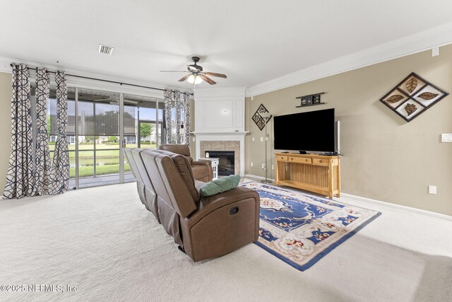11066 Castlemain Cir, Jacksonville, FL 32256 - living area with a ceiling fan, visible vents, crown molding, a fireplace, and carpet flooring