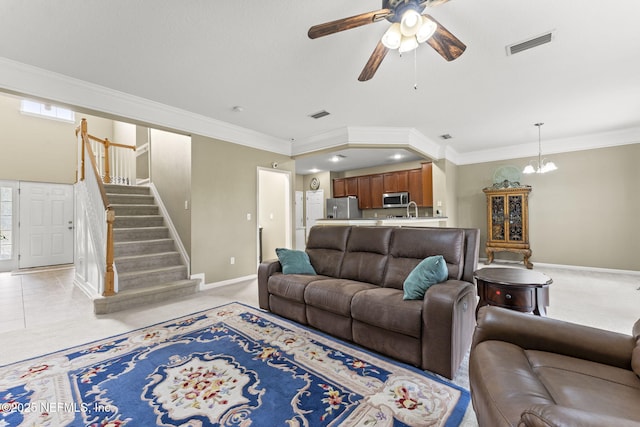 11066 Castlemain Cir, Jacksonville, FL 32256 - living room featuring crown molding, visible vents, stairway, and ceiling fan with notable chandelier