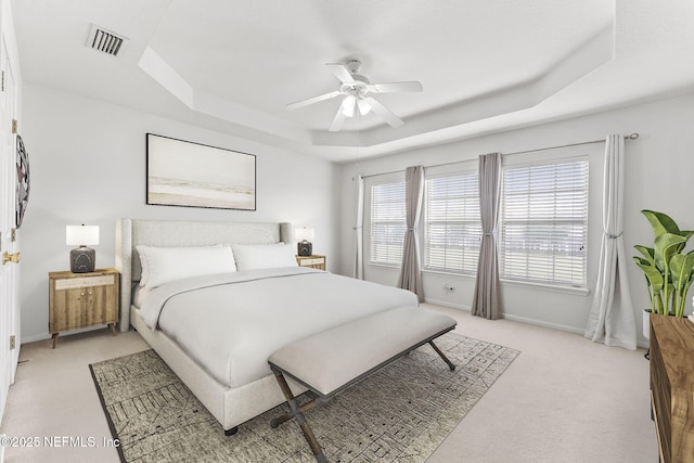 11066 Castlemain Cir, Jacksonville, FL 32256 - bedroom featuring visible vents, a raised ceiling, baseboards, and light colored carpet