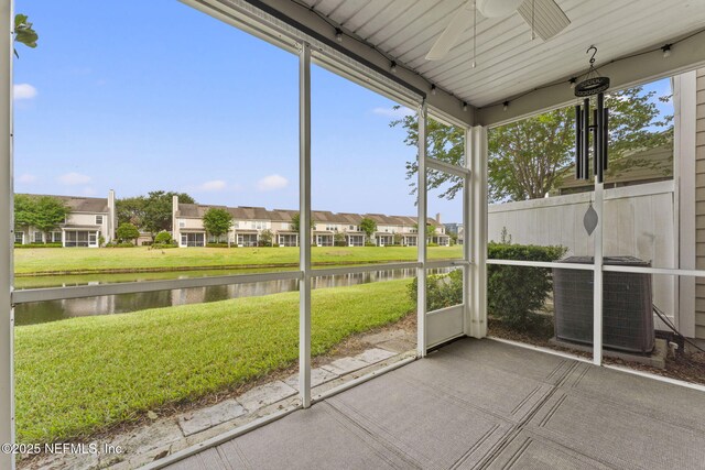 11066 Castlemain Cir, Jacksonville, FL 32256 - unfurnished sunroom featuring a healthy amount of sunlight, a water view, ceiling fan, and a residential view