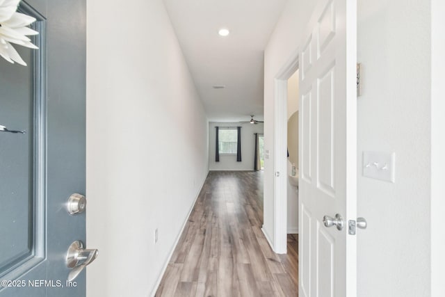 7686 Merchants Way, Jacksonville, FL 32222 - hallway featuring baseboards and wood finished floors