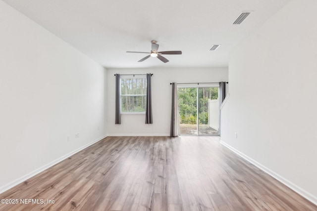 7686 Merchants Way, Jacksonville, FL 32222 - empty room with a ceiling fan, wood finished floors, baseboards, and visible vents
