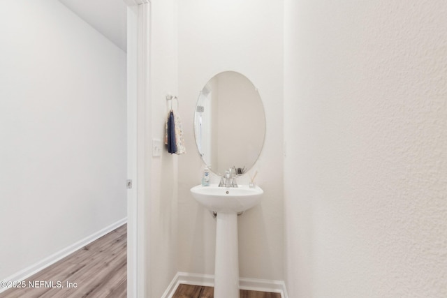 7686 Merchants Way, Jacksonville, FL 32222 - bathroom with baseboards and wood finished floors