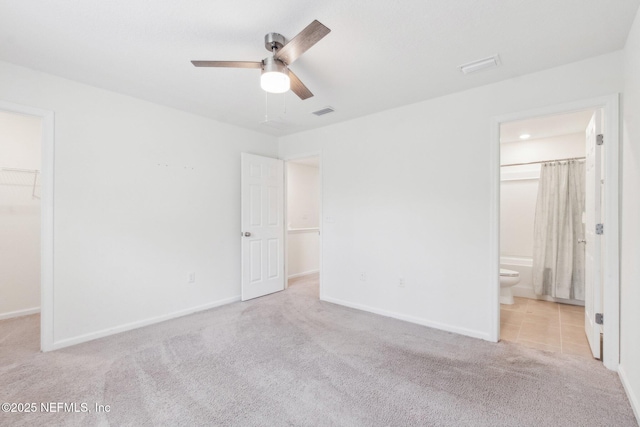 7686 Merchants Way, Jacksonville, FL 32222 - unfurnished bedroom featuring a closet, carpet floors, a spacious closet, baseboards, and visible vents