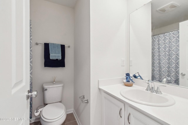 7686 Merchants Way, Jacksonville, FL 32222 - full bathroom featuring tile patterned flooring, vanity, toilet, baseboards, and visible vents