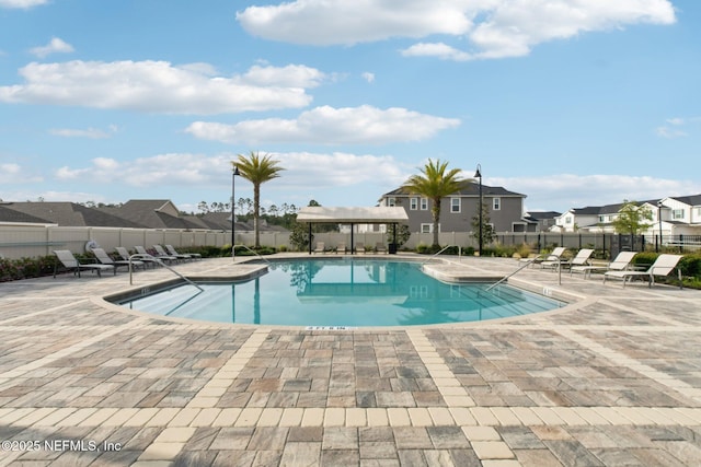 7686 Merchants Way, Jacksonville, FL 32222 - community pool featuring a patio, fence, and a residential view
