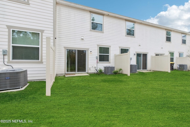 7686 Merchants Way, Jacksonville, FL 32222 - rear view of house with a lawn and central AC