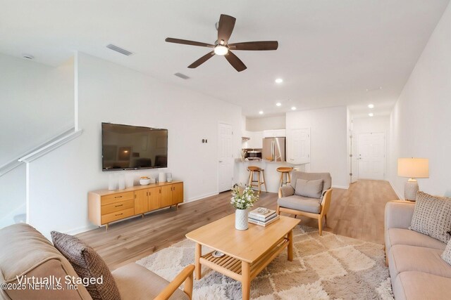 7686 Merchants Way, Jacksonville, FL 32222 - living area with visible vents, ceiling fan, and light wood-type flooring