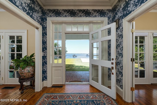 1301 Redbud Ln, Jacksonville, FL 32207 - entrance foyer with wallpapered walls, a water view, ornamental molding, and baseboards