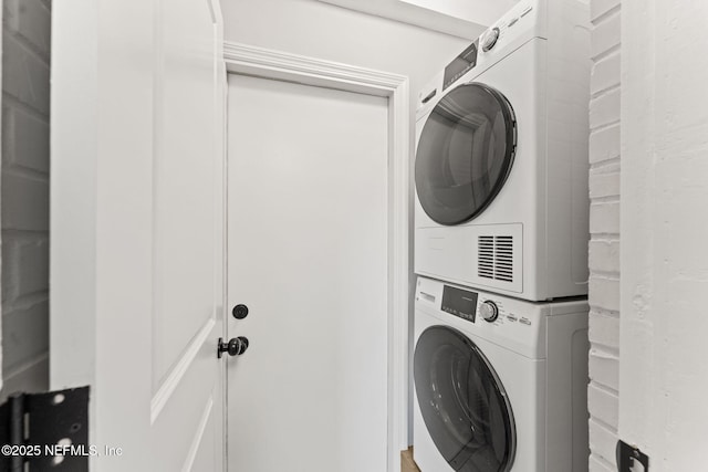 4651 Polaris St, Jacksonville, FL 32205 - laundry room featuring stacked washer and clothes dryer