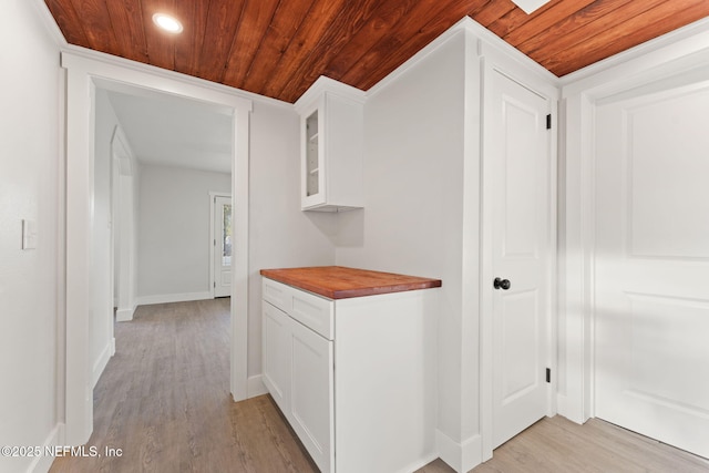 4651 Polaris St, Jacksonville, FL 32205 - hall featuring baseboards, light wood-style floors, wood ceiling, and recessed lighting