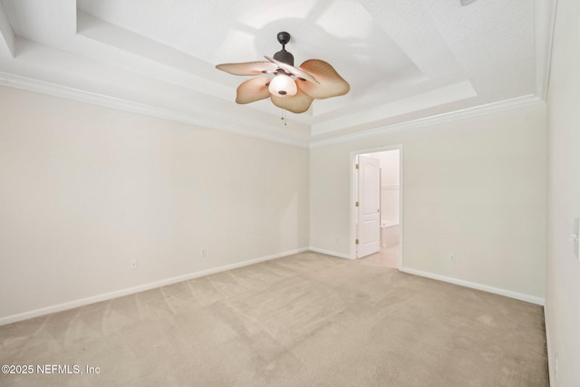 6376 Island Forest Dr Unit A, Fleming Island, FL 32003 - unfurnished room with a tray ceiling, light carpet, baseboards, a ceiling fan, and ornamental molding