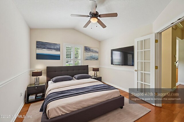 6376 Island Forest Dr Unit A, Fleming Island, FL 32003 - bedroom featuring wood finished floors, lofted ceiling, and ceiling fan