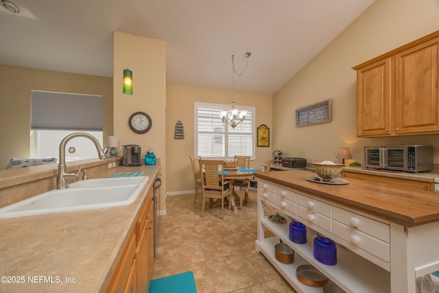 784 Crestwood Dr, Saint Augustine, FL 32086 - kitchen with vaulted ceiling, a toaster, a sink, butcher block counters, and a notable chandelier