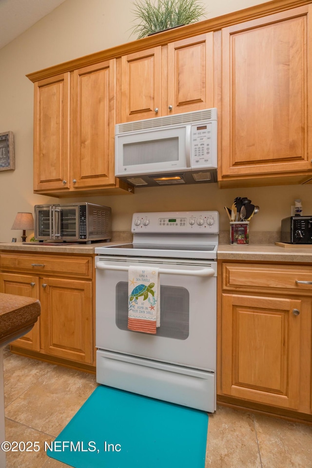 784 Crestwood Dr, Saint Augustine, FL 32086 - kitchen with light countertops, a toaster, and white appliances