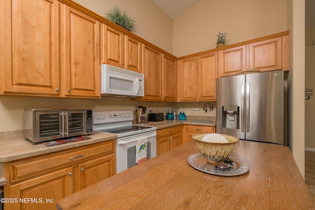784 Crestwood Dr, Saint Augustine, FL 32086 - kitchen with light countertops, a toaster, and white appliances