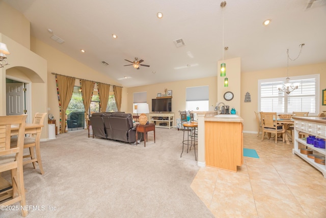 784 Crestwood Dr, Saint Augustine, FL 32086 - living room with light tile patterned floors, plenty of natural light, lofted ceiling, and visible vents