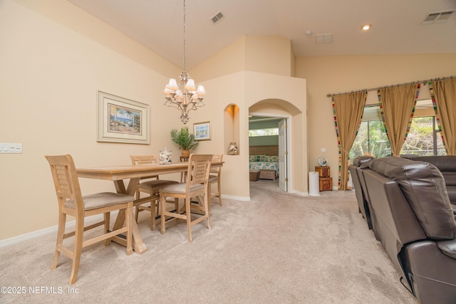 784 Crestwood Dr, Saint Augustine, FL 32086 - dining space with a notable chandelier, arched walkways, light colored carpet, and visible vents