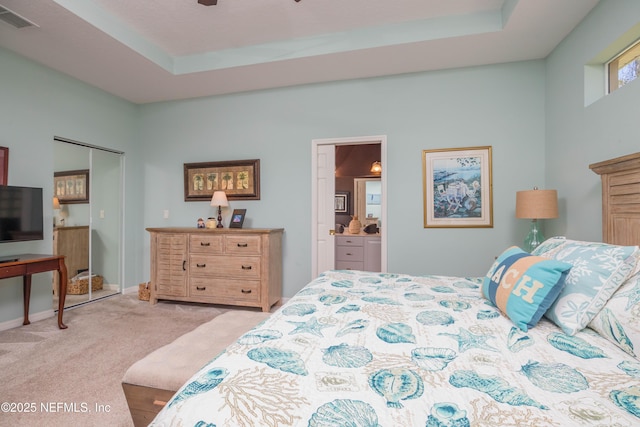 784 Crestwood Dr, Saint Augustine, FL 32086 - bedroom featuring light carpet, a tray ceiling, baseboards, and visible vents