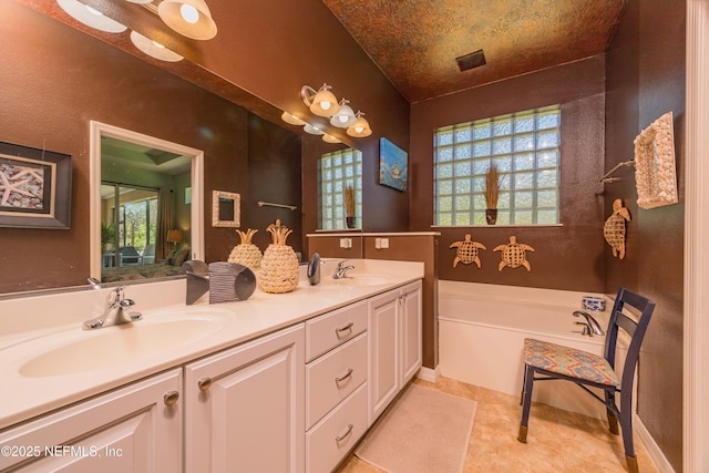 784 Crestwood Dr, Saint Augustine, FL 32086 - bathroom with double vanity, visible vents, a sink, and a garden tub