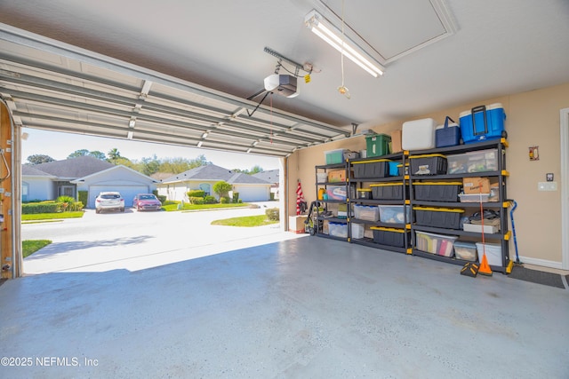 784 Crestwood Dr, Saint Augustine, FL 32086 - garage with baseboards and a garage door opener