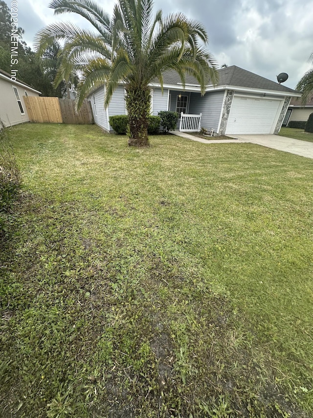 11326 Hendon Dr, Jacksonville, FL 32246 - view of front of home featuring fence, a garage, a front lawn, driveway, and covered porch