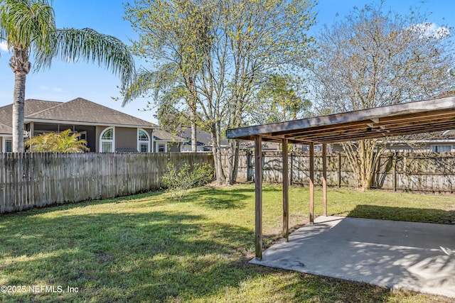 11326 Hendon Dr, Jacksonville, FL 32246 - view of yard with a fenced backyard, a detached carport, and a patio