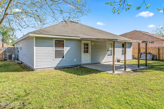 11326 Hendon Dr, Jacksonville, FL 32246 - rear view of house with a fenced backyard, central air condition unit, a yard, and a patio