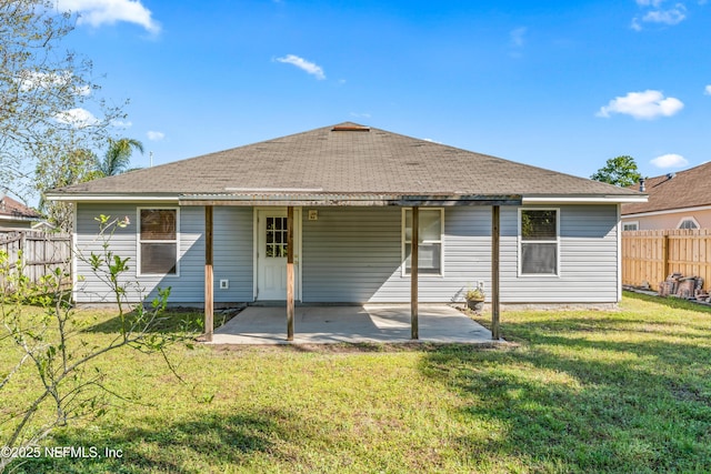 11326 Hendon Dr, Jacksonville, FL 32246 - rear view of property featuring roof with shingles, a lawn, fence, and a patio