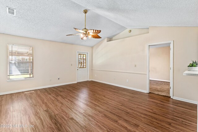 11326 Hendon Dr, Jacksonville, FL 32246 - empty room featuring a ceiling fan, wood finished floors, a healthy amount of sunlight, and visible vents