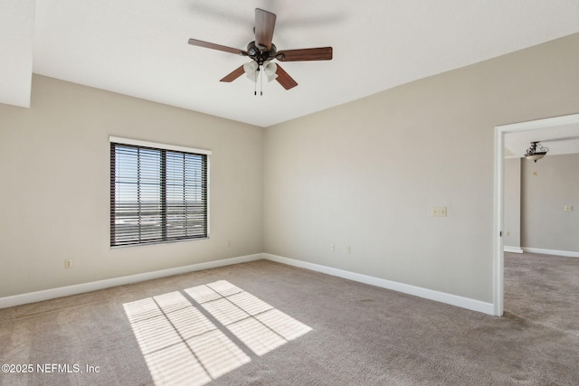 unfurnished room with carpet, baseboards, and ceiling fan