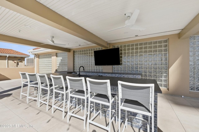 view of patio / terrace with outdoor dining area and ceiling fan