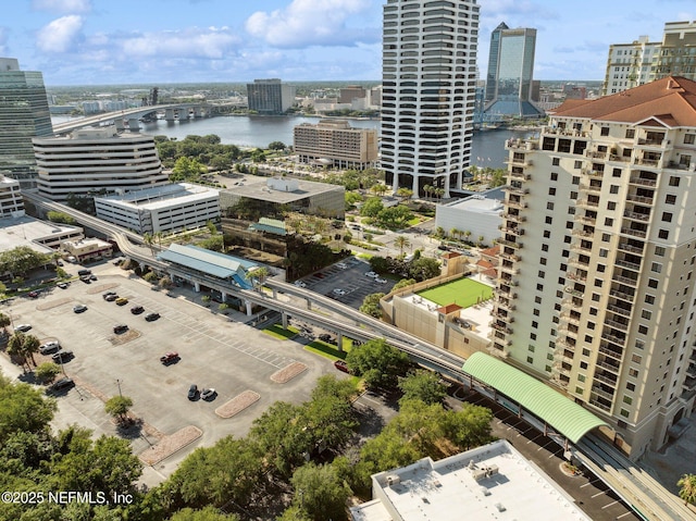 drone / aerial view featuring a water view and a view of city
