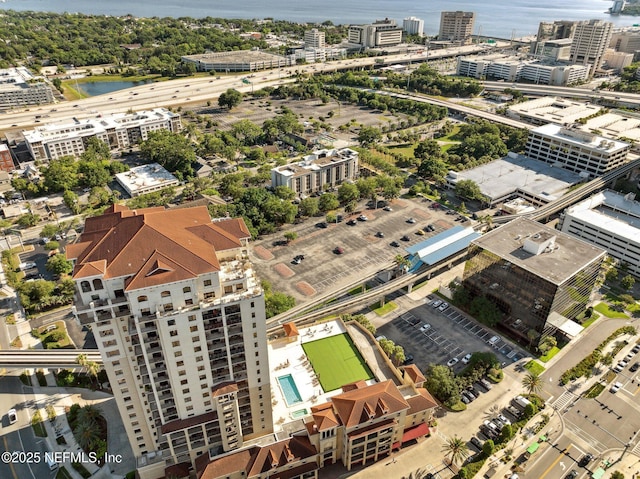 birds eye view of property with a city view and a water view