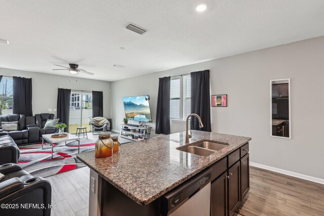 7802 Merchants Way, Jacksonville, FL 32222 - kitchen with open floor plan, a wealth of natural light, a sink, and dishwasher