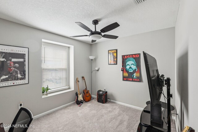 7802 Merchants Way, Jacksonville, FL 32222 - workout area featuring a textured ceiling, carpet floors, baseboards, and a ceiling fan